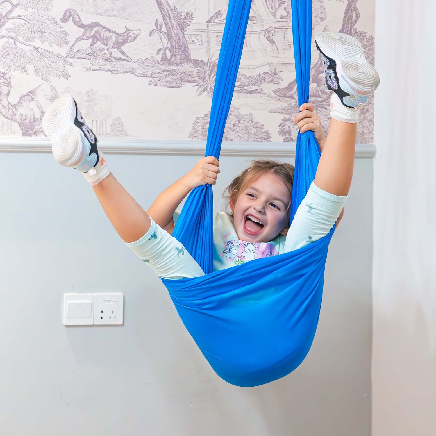 Child enjoying calming sensory swing in NZ home